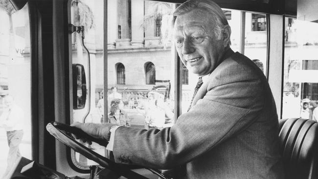 Driving force: Clem Jones at the wheel of a new Brisbane City Council bus in 1975. Picture: Stuart Riley