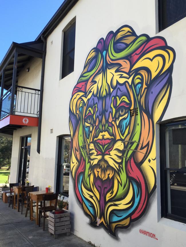 Exterior street art at Aslan Coffee