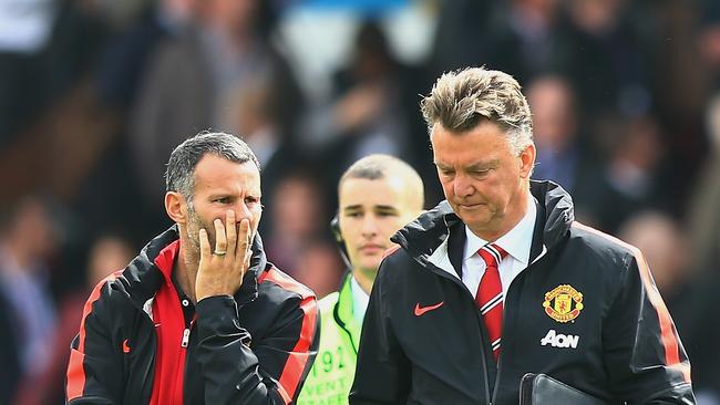 BURNLEY, ENGLAND - AUGUST 30: Assistant Ryan Giggs of Manchester United talks to Manager Louis van Gaal of Manchester United at the end of the Barclays Premier League match between Burnley and Manchester United at Turf Moor on August 30, 2014 in Burnley, England. (Photo by Mark Thompson/Getty Images)