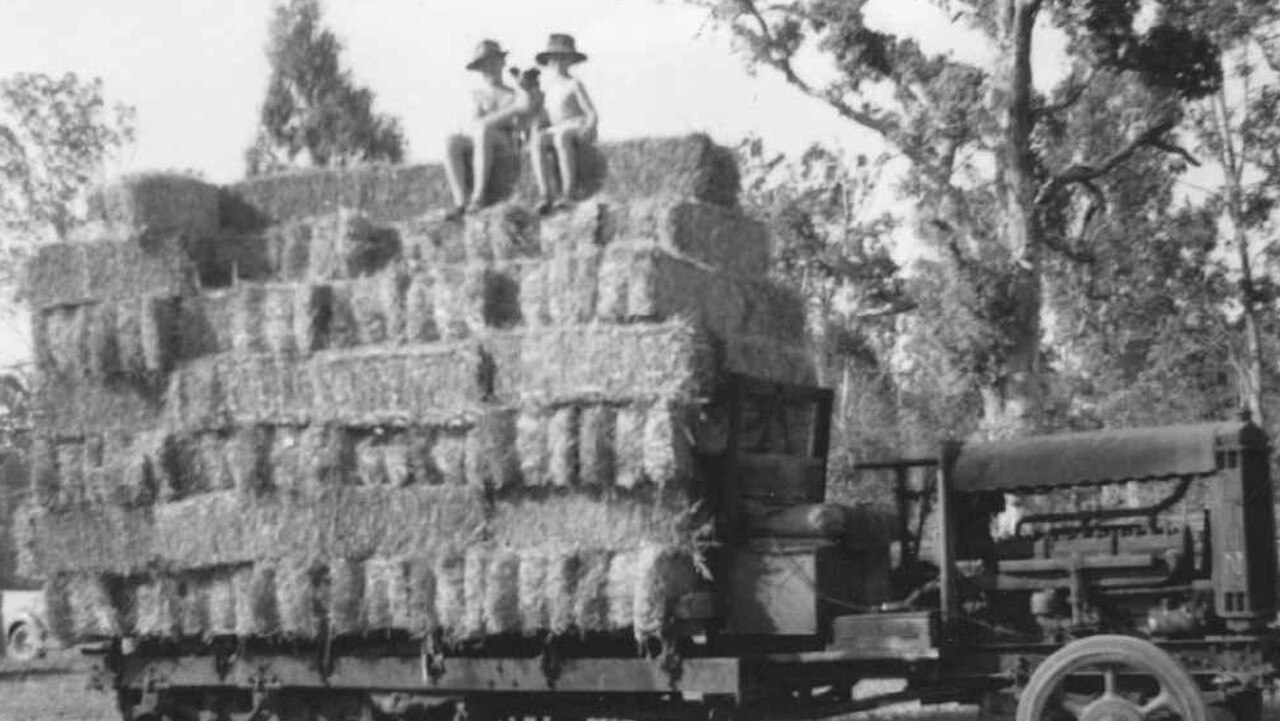 EARLY DAYS: John and Eric Scott in the mid-1950s, sitting atop a load of hay on the same Linn tractor that they still use on the farm today. Picture: Contributed