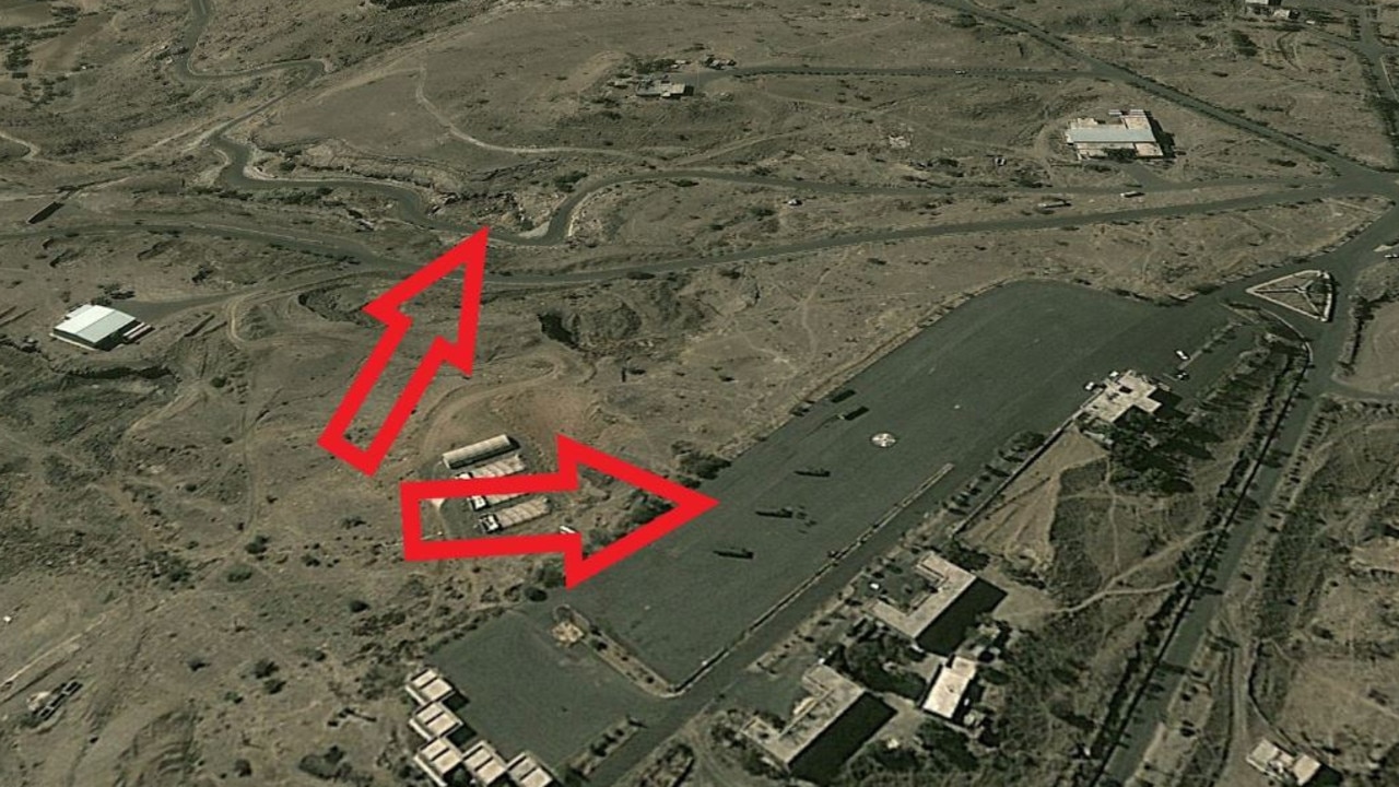 This 2011 Google Maps satellite image shows ballistic-missile carrying trucks parked at a Houthi facility on the outskirts of the city of Sanaa. Analysts have since identified a new underground storage facility cut into a nearby cliff face. Source: Google Maps.