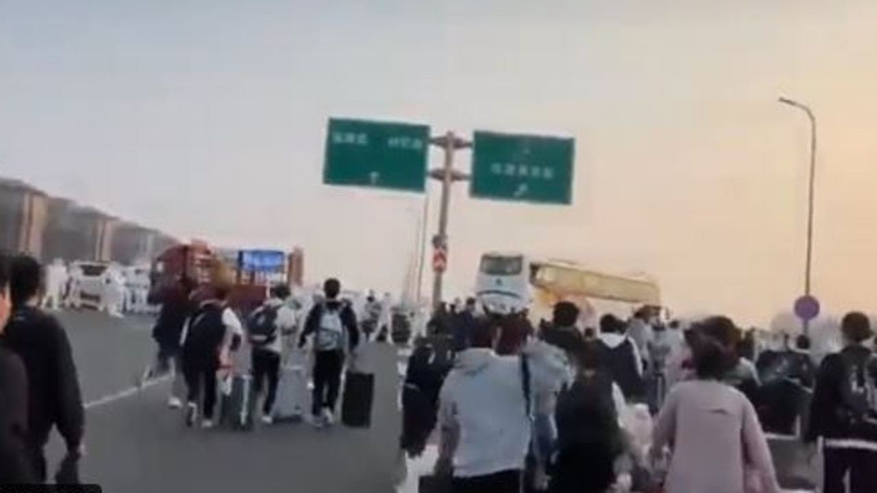 Thousands of Foxconn workers fled the factory on foot, some walking for hours to get home. Picture: Twitter