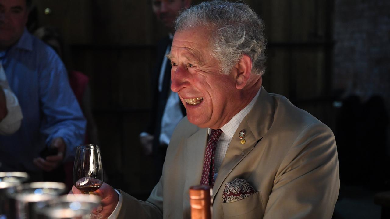 Prince Charles gets a kick out of his visit to the Bundaberg Rum Distillery.