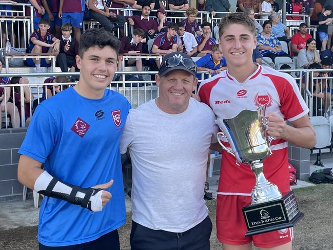 Palm Beach Currumbin players Marley McLaren and Taj lateo with Broncos legend Kevin Walters after the school won the Walters Cup.