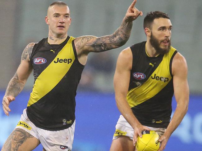 AFL Round 20. 03/08/2019.   Melbourne v Richmond at the MCG.  Richmonds Dustin Martin  directs traffic behind  Shane Edwards      .  Pic: Michael Klein