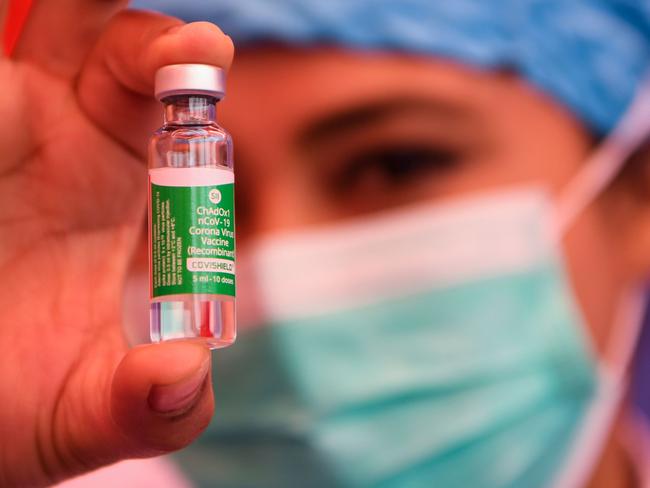 A health worker shows a vial of Covishield, AstraZeneca-Oxford's Covid-19 coronavirus vaccine, at Patan Hospital near Kathmandu on January 27, 2021. (Photo by Prakash MATHEMA / AFP)