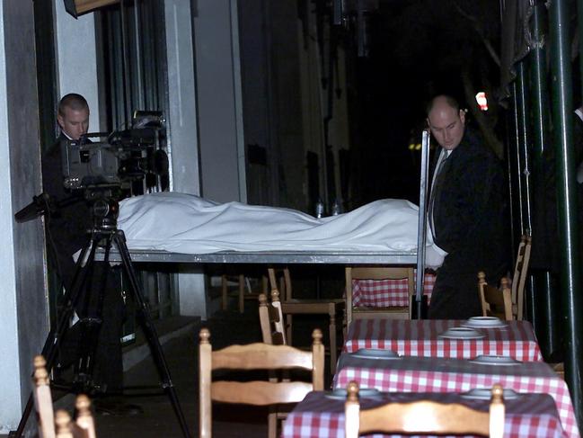 Veniamin’s body is carried out of La Porcella restaurant in Rathdowne Street, Carlton.