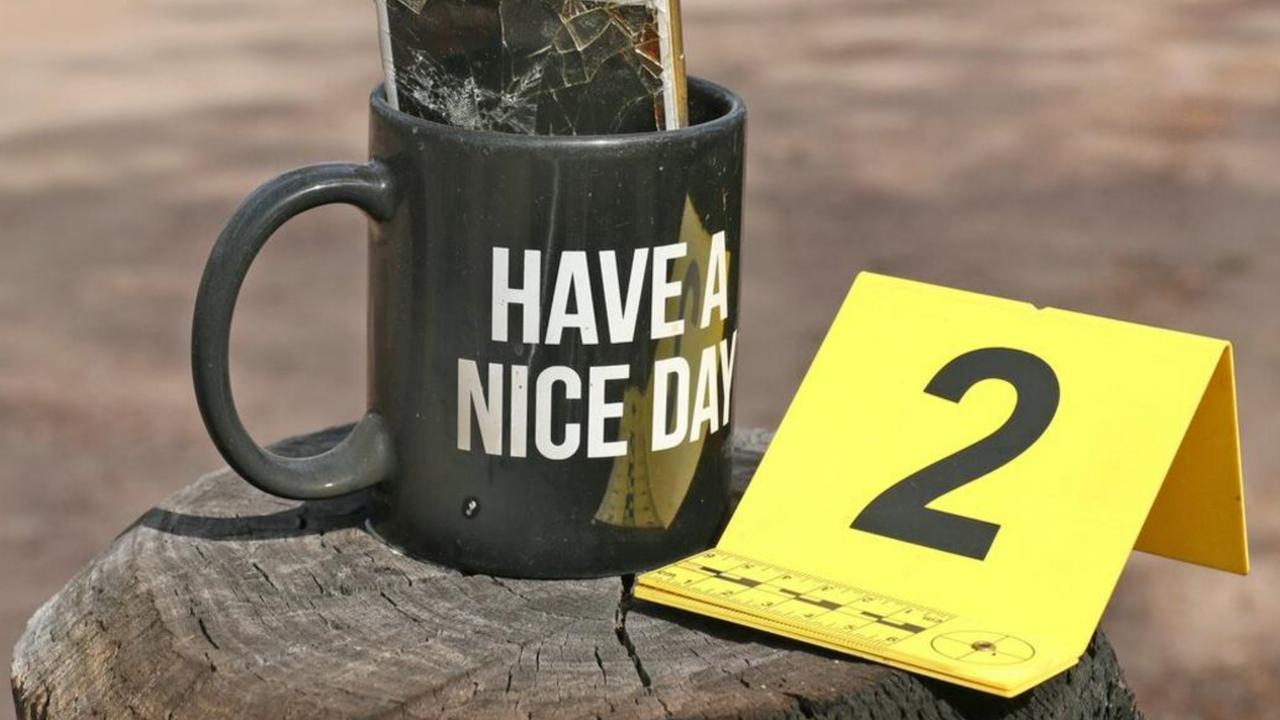 A mug printed with the words ‘Have A Nice Day’ was found attached to the Trains’ letterbox. It contained a smashed iPhone that had an expletive word printed at the top. Picture: Supplied