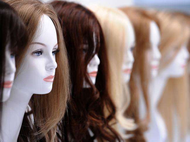 Mannequins wearing wigs for women made of real hair are displayed at the 'Top Hair' trade fair in Duesseldorf, 21/03/2011. The Top Hair International Trend and Fashion Days 2011 showcases activities and techniques for hairdressers presented by some 400 exhibitors.