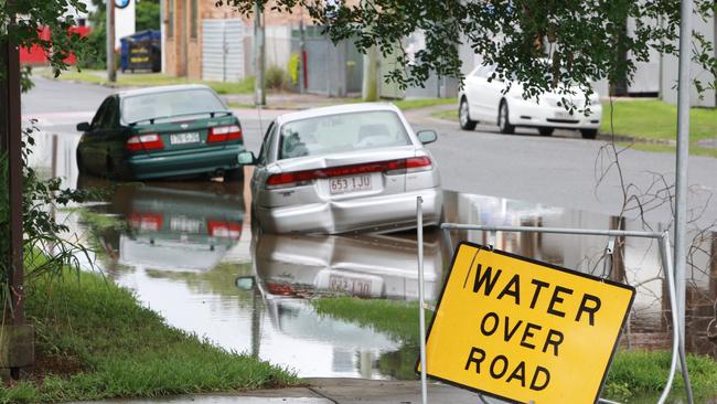 Areas in Brisbane, such as here on Victoria St, Windsor, regularly flood during king tides. Motorists are warned not to expose their cars to salt water, as it causes rust. Picture: Jono Searle