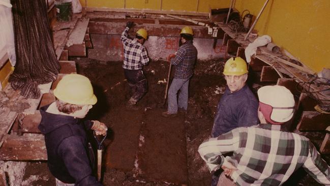 People work at excavating the crawl space under Gacy's home circa late 1978 or early 1979. This photograph was used at Gacy's trial. Picture: Supplied