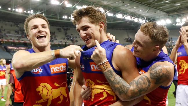 Teammates Mitch Robinson and Lincoln McCarthy signalling to the man of the moment. Picture: Getty Images