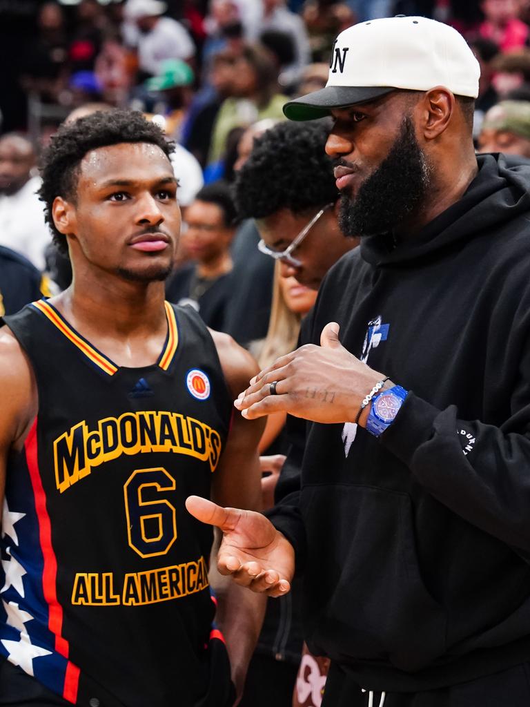 Bronny James talks tactics with Lebron James. Photo by Alex Bierens de Haan/Getty Images.