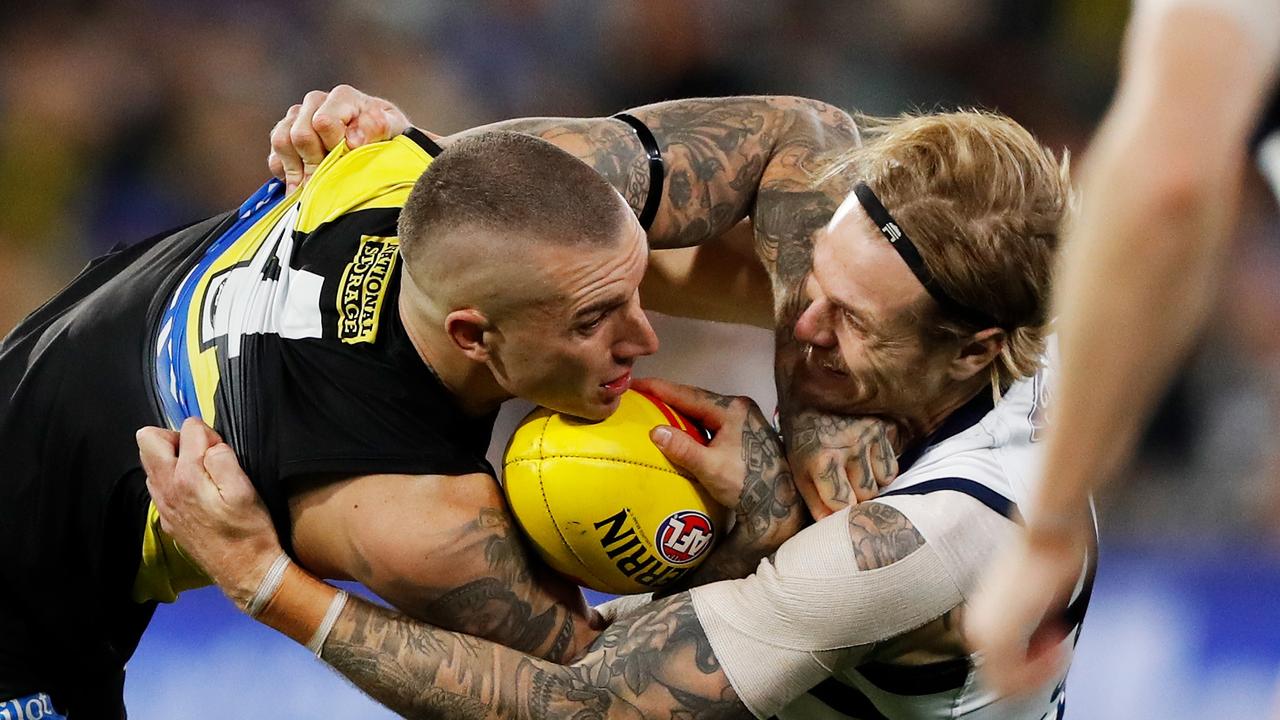 Tom Stewart puts a big tackle on Dustin Martin.