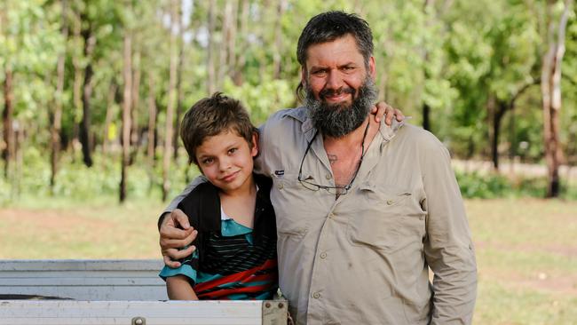 Jason Cash with his hero son Max, 8, after Jason was bitten by a brown snake he mistook for a small python. Picture: Glenn Campbell