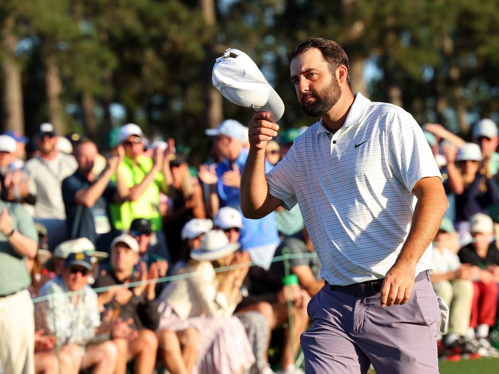 Scottie Scheffler tips his hat to the crowd on the 18th green. Picture: Getty