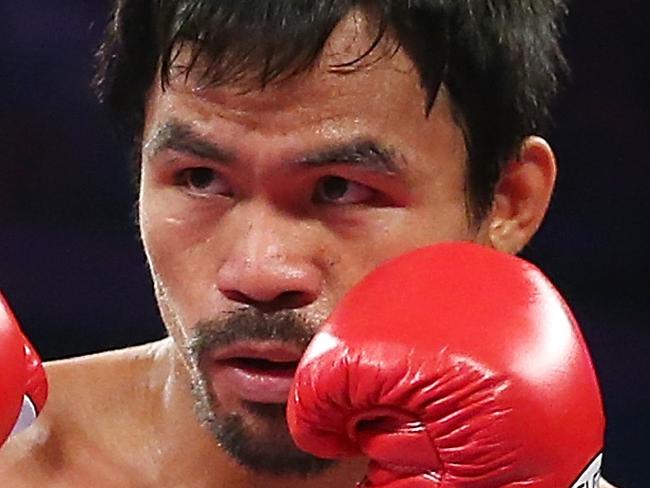 MACAU - NOVEMBER 23: Manny Pacquiao of the Philippines in the ring against Chris Algieri of the United States during the WBO world welterweight title at The Venetian on November 23, 2014 in Macau, Macau. (Photo by Chris Hyde/Getty Images)