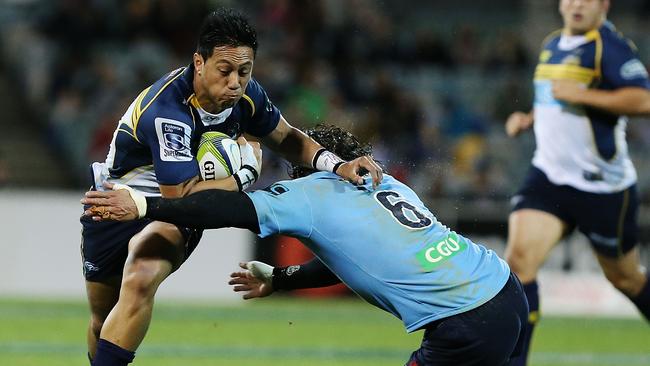 Christian Lealiifano of the Brumbies evades the tackle of Jacques Potgieter.