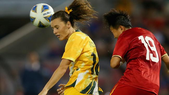 Hayley Raso rises above the Vietnam defence.