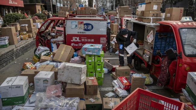 Boxes pile up in the streets of Beijing as China’s supply chain collapses. Picture: Kevin Frayer / Getty Images.