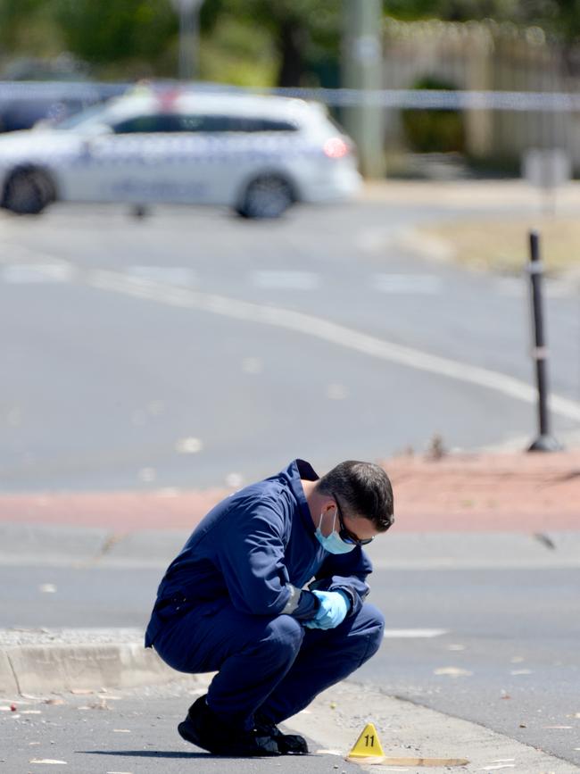 Police investigate the area around Keilor Plains railway station. Picture: Andrew Henshaw