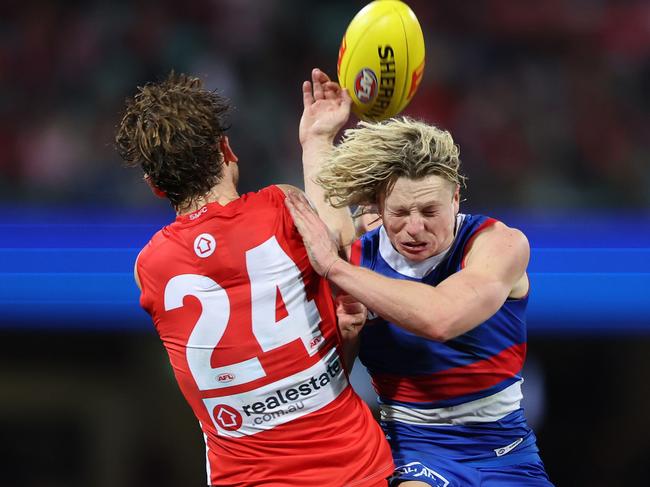SYDNEY, AUSTRALIA - JULY 13:  Dane Rampe of the Swans and  Cody Weightman of the Bulldogs compete for the ball during the round 18 AFL match between Sydney Swans and Western Bulldogs at Sydney Cricket Ground, on July 13, 2023, in Sydney, Australia. (Photo by Mark Metcalfe/AFL Photos/via Getty Images)