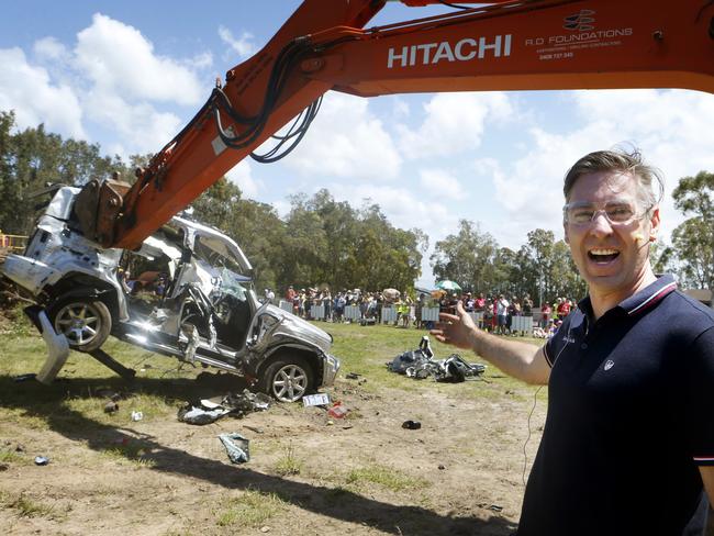 Ashton Wood gets help to destroy his Jeep that was a lemon from the moment he drove it out of the dealer ship. Bli Bli. Pic Megan Slade