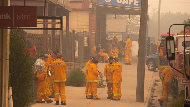 Corryong Fires Scenes from the Main Street of Corryong, residents who are in town cannot leave without being forced to stay out. CFA and emergency services gather in the Main Street. Picture: Jason Edwards