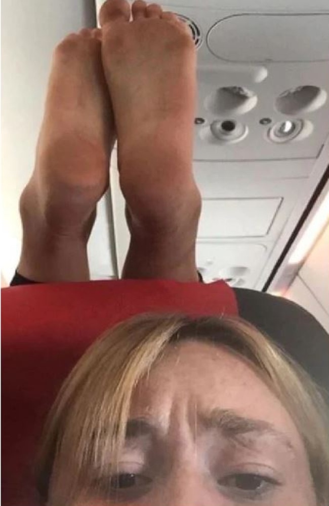 A passenger was horrified by a stranger’s dirty feet on her headrest in November.