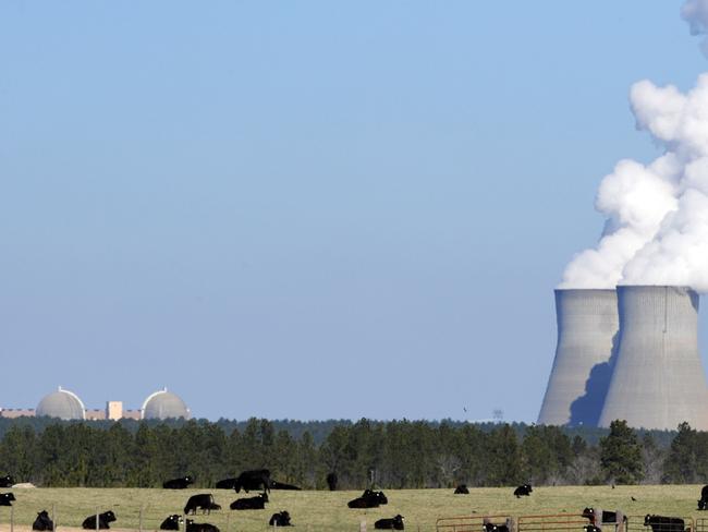 epa05874675 (FILE) - A file picture dated 17 February 2010 shows cattle grazing in the shadow of the cooling towers for Georgia Power's Plant Vogtle nuclear power plant that use the Westinghouse AP1000 advanced pressurized water reactor technology, Waynesboro, Georgia USA. Media reports on 28 March 2017 state Westinghouse, that is owned by Japanese Toshiba Corporation, may be in the process of filing for Chapter 11 bankruptcy protection in USA as early as 28 March. Westinghouse has suffered massive losses that are also affecting its parent company Toshiba. A possible bankruptcy would at least temporarily halt Westinghouse's nuclear construction activity and payments of loans.  EPA/ERIK S. LESSER