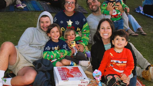 Gavin, Arabella, Gigi, Annalisa, Samantha, Loris, Leo and Luciano getting festive at the Phillip Island Christmas Carols by the Bay at the Cowes Foreshore on Tuesday, December 10, 2024. Picture: Jack Colantuono