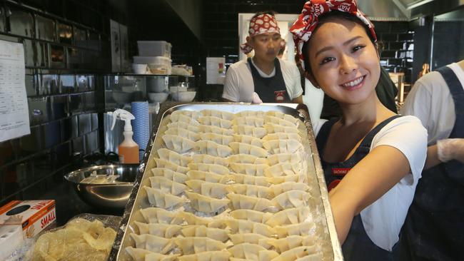 Sachime Watanabe holds up a tray of freshly handmade gyoza at Harajuku Gyoza. Picture Glenn Hampson