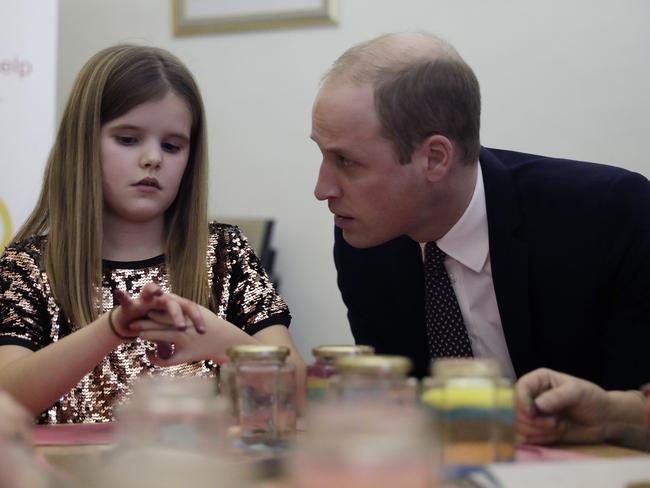 Britain's Prince William speaks to Aoife, 9, during his visit to a Child Bereavement UK Centre in Stratford in East London. He comforted her after she lost a parent. Picture: AP