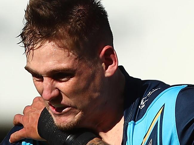 GOLD COAST, AUSTRALIA - JULY 29:  Alexander Brimson of the Titans is tackled during the round 20 NRL match between the Gold Coast Titans and the New Zealand Warriors at Cbus Super Stadium on July 29, 2018 in Gold Coast, Australia.  (Photo by Chris Hyde/Getty Images)