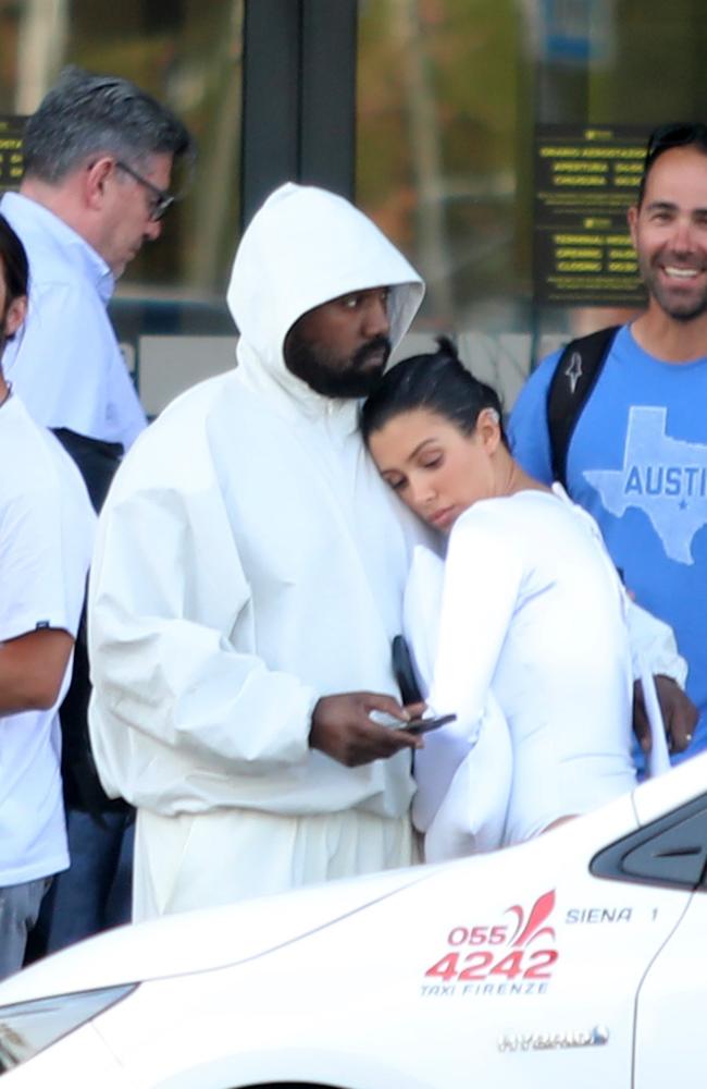 The loved-up pair shared a sweet embrace as they waited for their car to arrive. Picture: Backgrid.