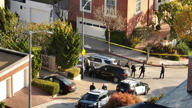 San Francisco police officers and F.B.I. agents gather in front of the home of U.S. Speaker of the House Nancy Pelosi. Picture: Justin Sullivan/Getty Images/AFP