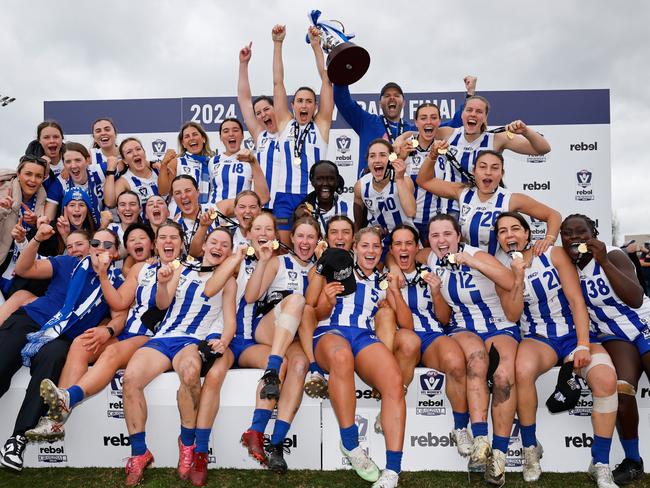 MELBOURNE, AUSTRALIA - JULY 21: The Kangaroos pose for their premiership photo during the 2024 rebel VFLW Grand Final match between North Melbourne and the Western Bulldogs at ETU Stadium on July 21, 2024 in Melbourne, Australia. (Photo by Dylan Burns/AFL Photos)