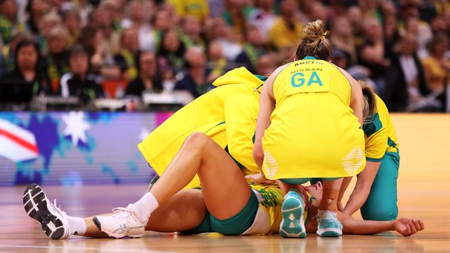 Maddy Proud receives after a heavy collision while playing for Australia. Picture: Getty