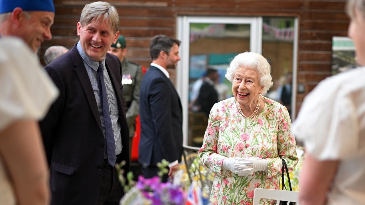 Her Majesty’s face lights up as she realises the person in front of her is, for once, not a politician. Picture: Oli Scarff/Getty Images