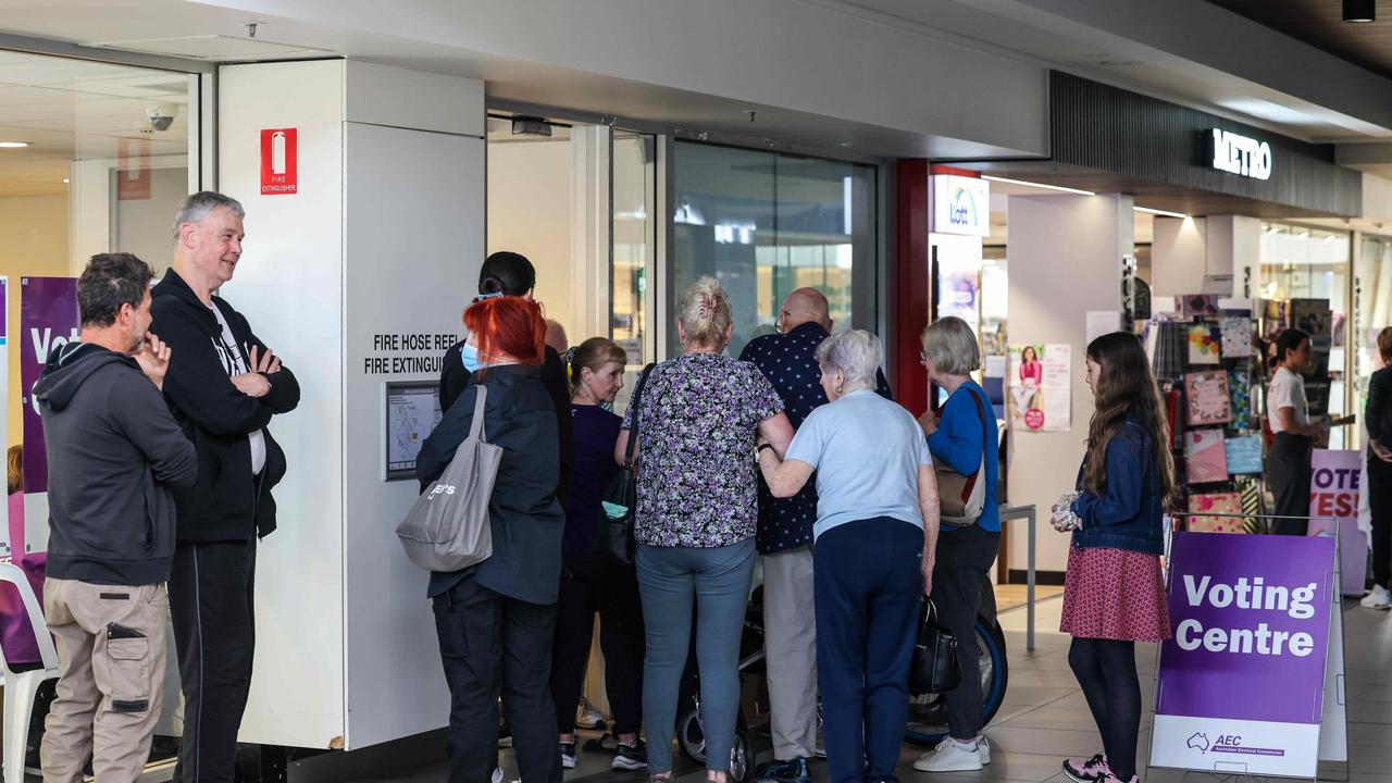 Early voters waiting for booths to open at the Marden Shopping Centre. Picture: Russell Millard