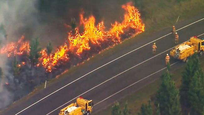 Firefighters battle a bushfire in Beerwah. Picture: 9 News