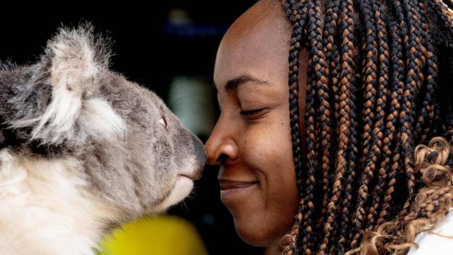 US tennis star Coco Gauff shares a quiet moment with a true blue Aussie fan on day three of the Australian Open in Melbourne. Picture: AFP