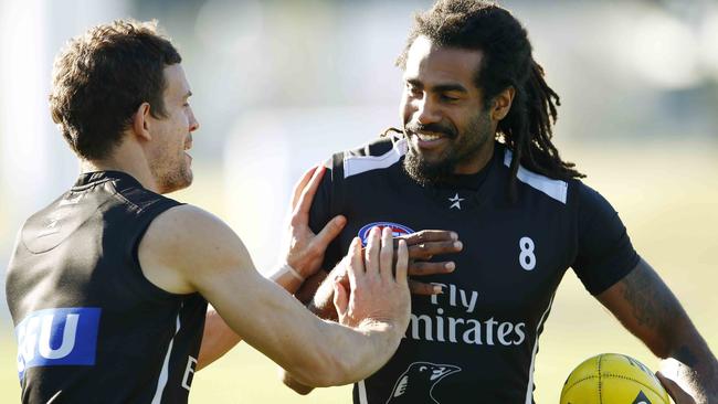 Heritier Lumumba with Luke Ball at a Collingwood training session.