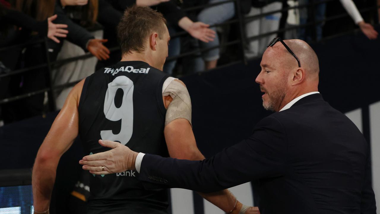 Luke Sayers with captain Patrick Cripps. Picture: Michael Klein