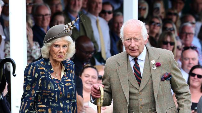 BRAEMAR, SCOTLAND - SEPTEMBER 08: King Charles III and Queen Camilla laugh as they sit in the Royal box and attend The Braemar Gathering 2024 at The Princess Royal and Duke of Fife Memorial Park on September 08, 2024 in Braemar, Scotland. The Braemar Gathering, renowned globally, is the most famous of the Highland Games. Every year, on the first Saturday in September, this vibrant Scottish tradition draws thousands of visitors to the small village of Braemar. With a history spanning nearly two centuries in its modern form, the Gathering stands as one of Scotland's most celebrated events. (Photo by Chris Jackson/Getty Images)