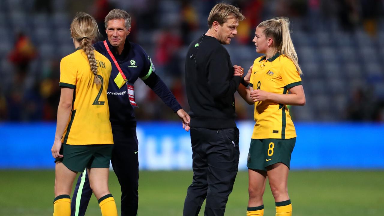 Tony Gustavsson consoles Charlotte Grant of Australia after their sides defeat during the Women's International Friendly match between Spain and Australia at Estadio Nuevo Colombino on June 25, 2022 in Huelva, Spain. Photo by Fran Santiago/Getty Images
