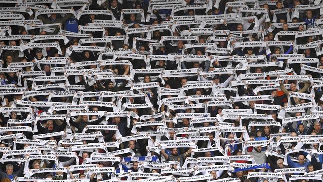 Fans hold scarfs for Leicester City Chairman Vichai Srivaddhanaprabha during the match. Picture: AP