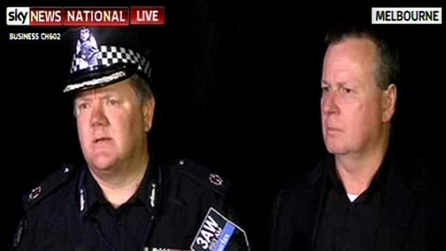 Victoria Police Assistant Commissioner Luke Cornelius and AFP Commander Bruce Giles speak at a press conference at the scene.