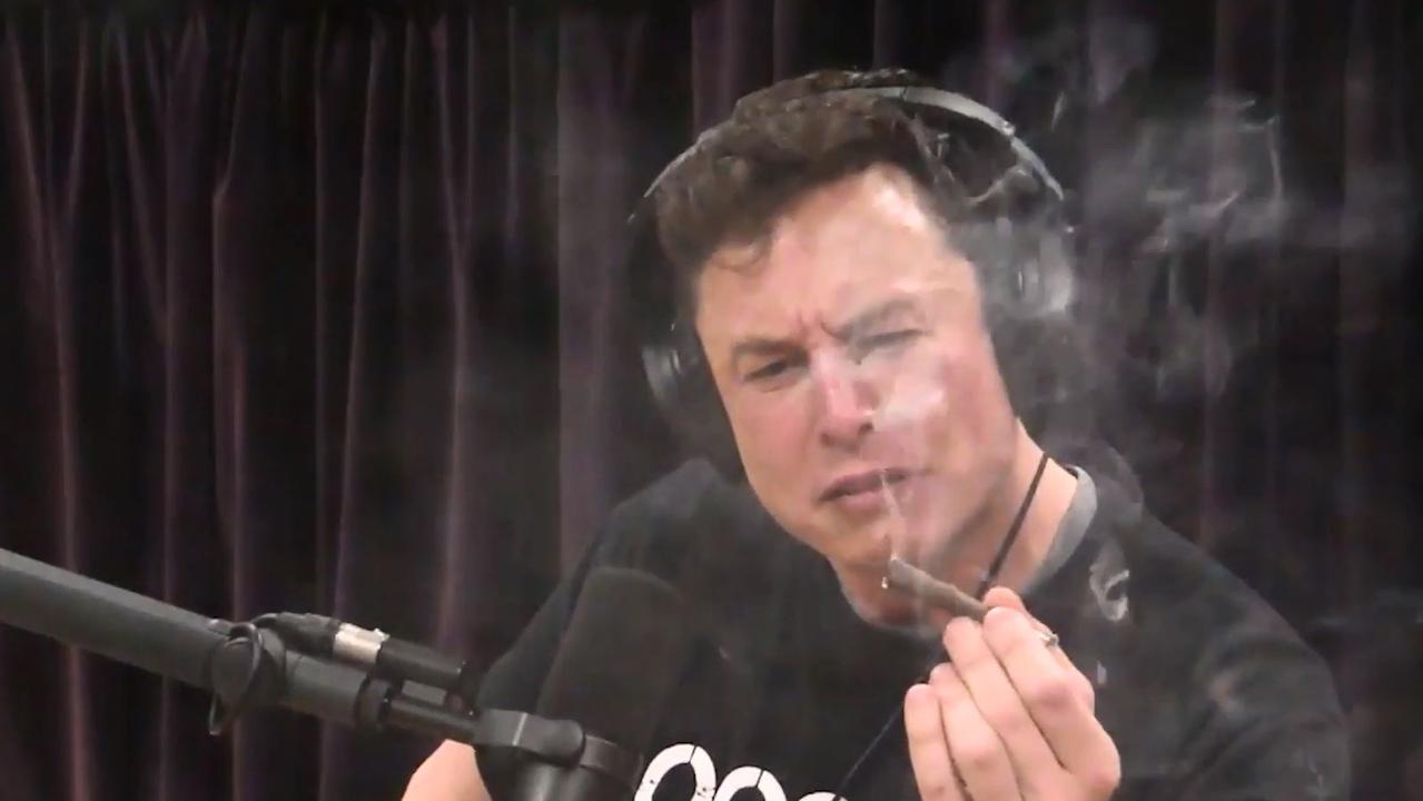 Elon Musk struggling to take a rare hit of ‘pot’.