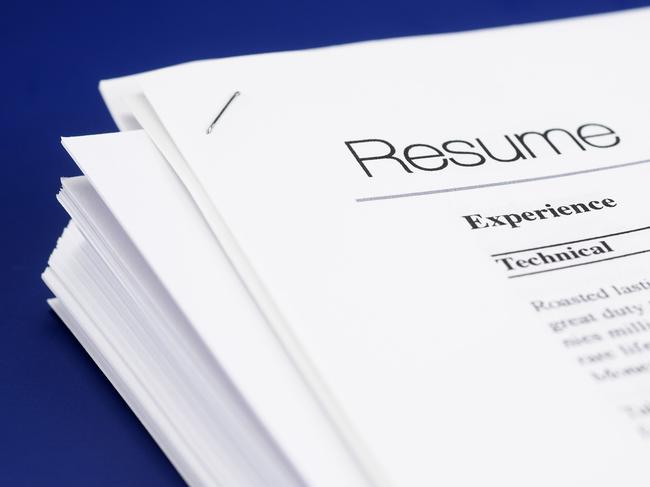 Stock photo of mock resume on blue